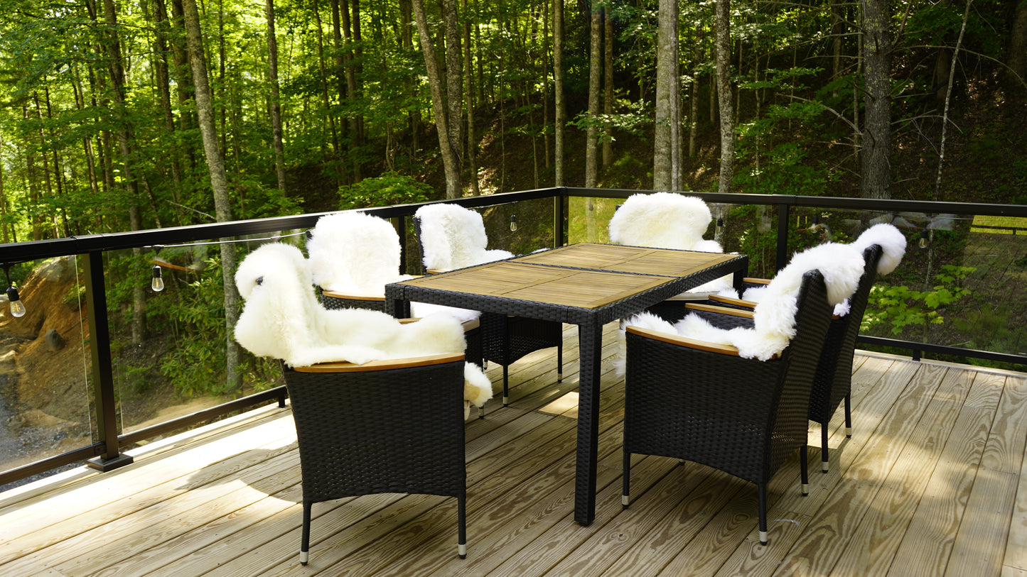 Natural sheepskin rug styled on outdoor chairs for warmth and comfort