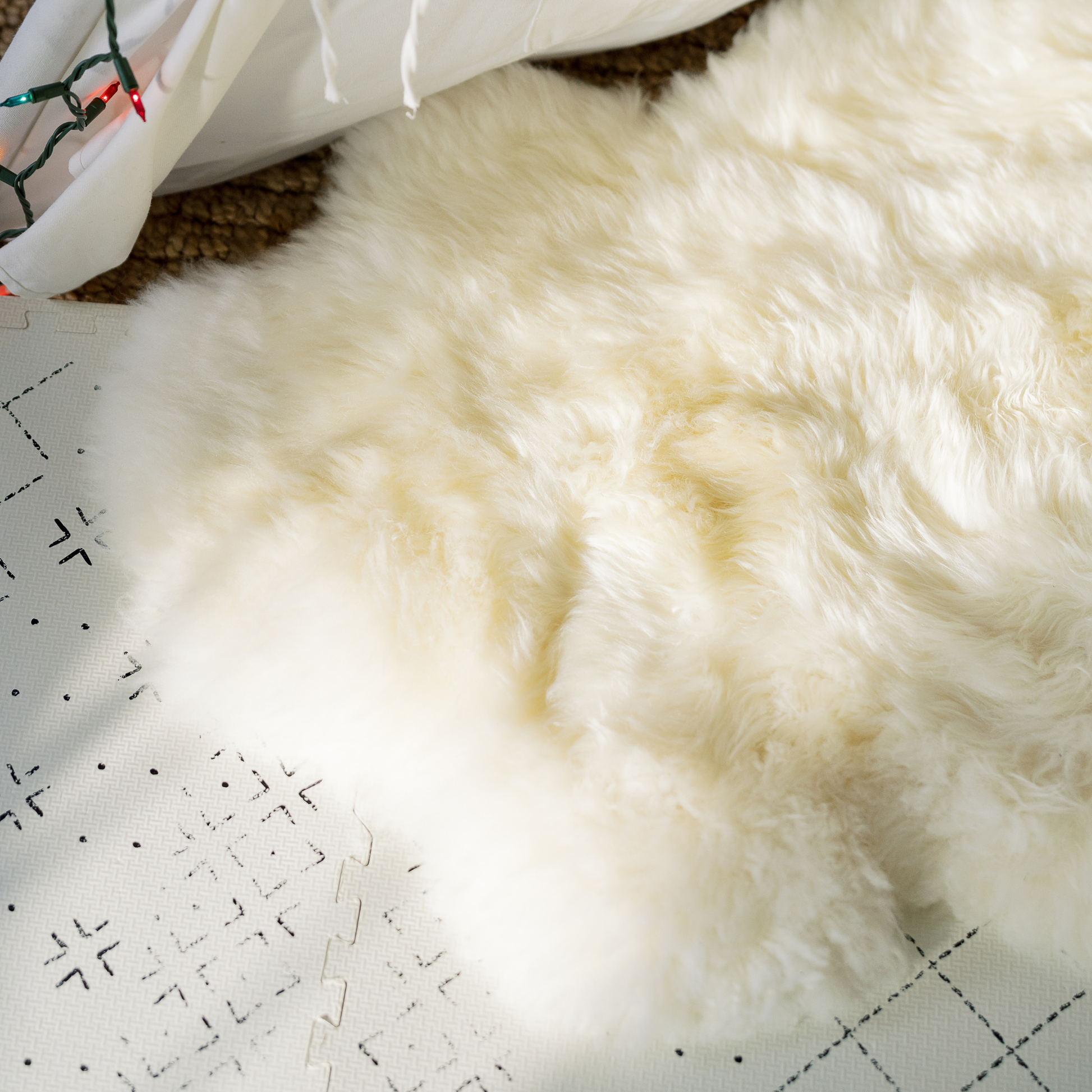Close-up of plush wool fibers on a natural sheepskin rug
